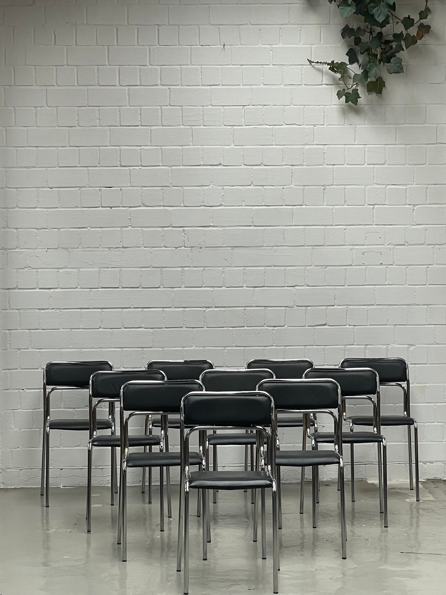 Bauhaus | Chrome | Stackable | Chair | modern | Vintage | upholstered in a black faux leather