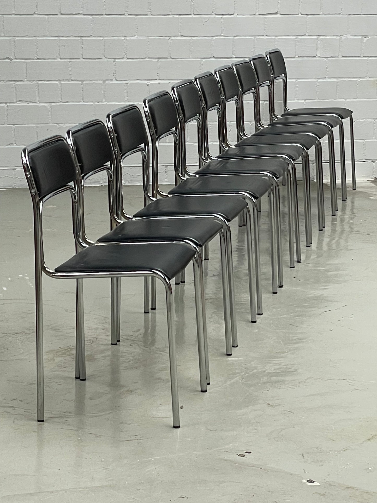 Bauhaus | Chrome | Stackable | Chair | modern | Vintage | upholstered in a black faux leather