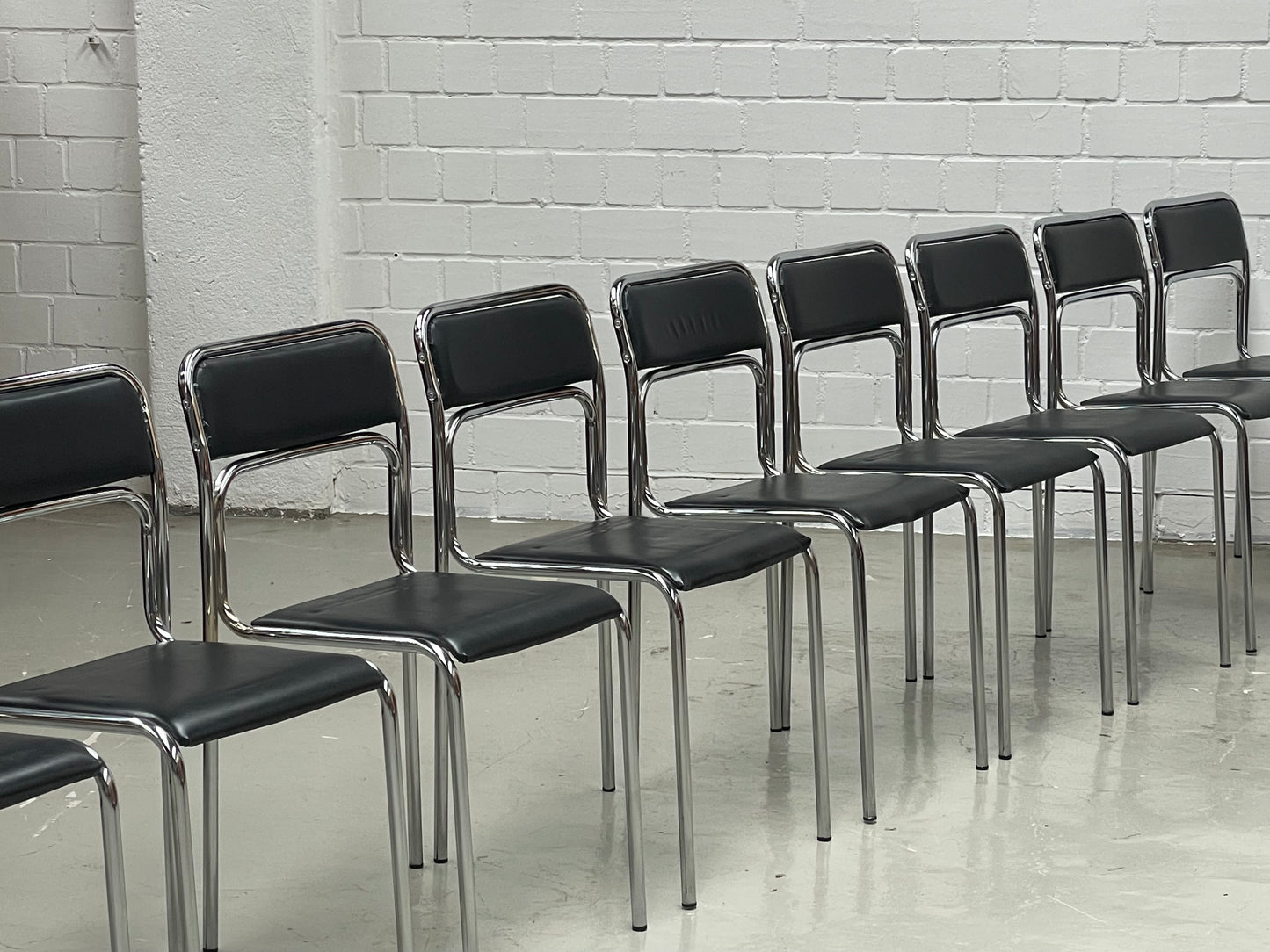 Bauhaus | Chrome | Stackable | Chair | modern | Vintage | upholstered in a black faux leather
