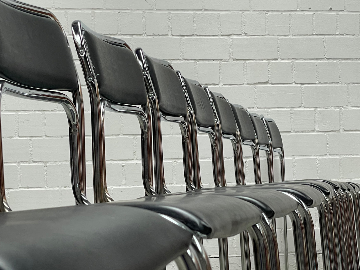 Bauhaus | Chrome | Stackable | Chair | modern | Vintage | upholstered in a black faux leather