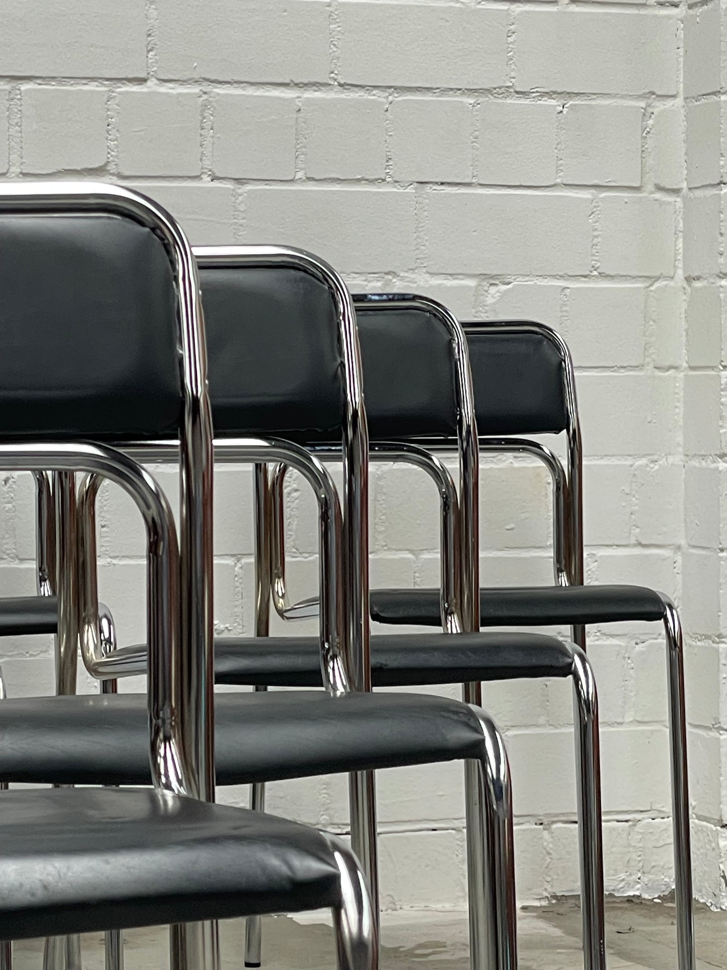 Bauhaus | Chrome | Stackable | Chair | modern | Vintage | upholstered in a black faux leather
